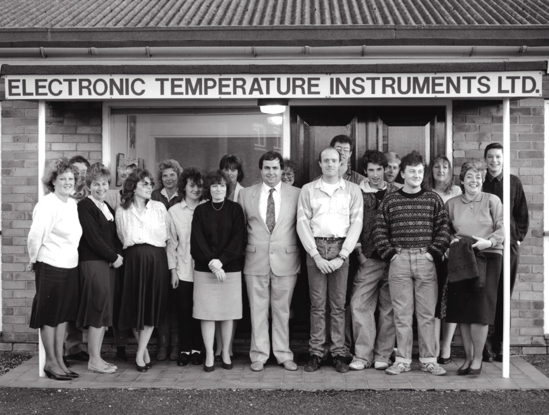 Group of ETI workers stood outside factory in 1995