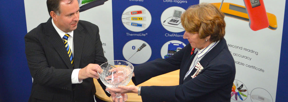 The founder of ETI accepting a 2014 Queen's Award for International Trade