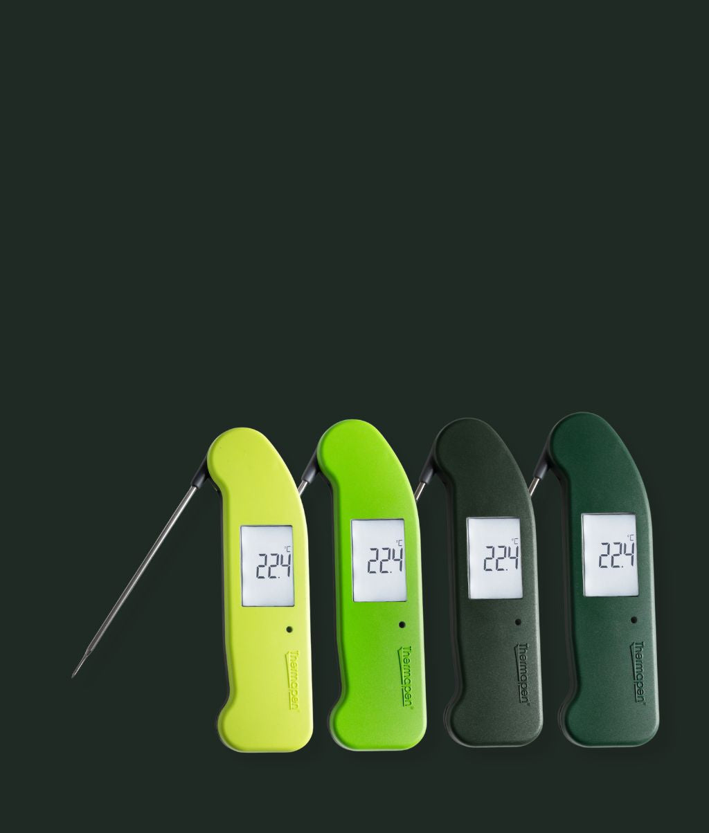 Four Thermapen ONE Thermometer with different color options on a green background