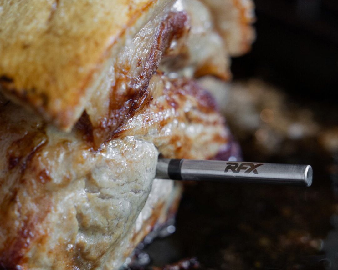 Close-up of a meat with a RFX  inside measuring the temperature of the meat