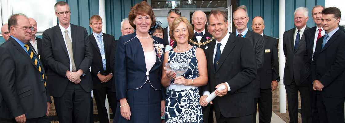 The founder of ETI and his wife accepting a 2012 Queen's Award for International trade