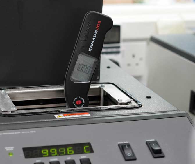 Kamado Joe design printed Thermapen ONE in a calibration bath for quality checks