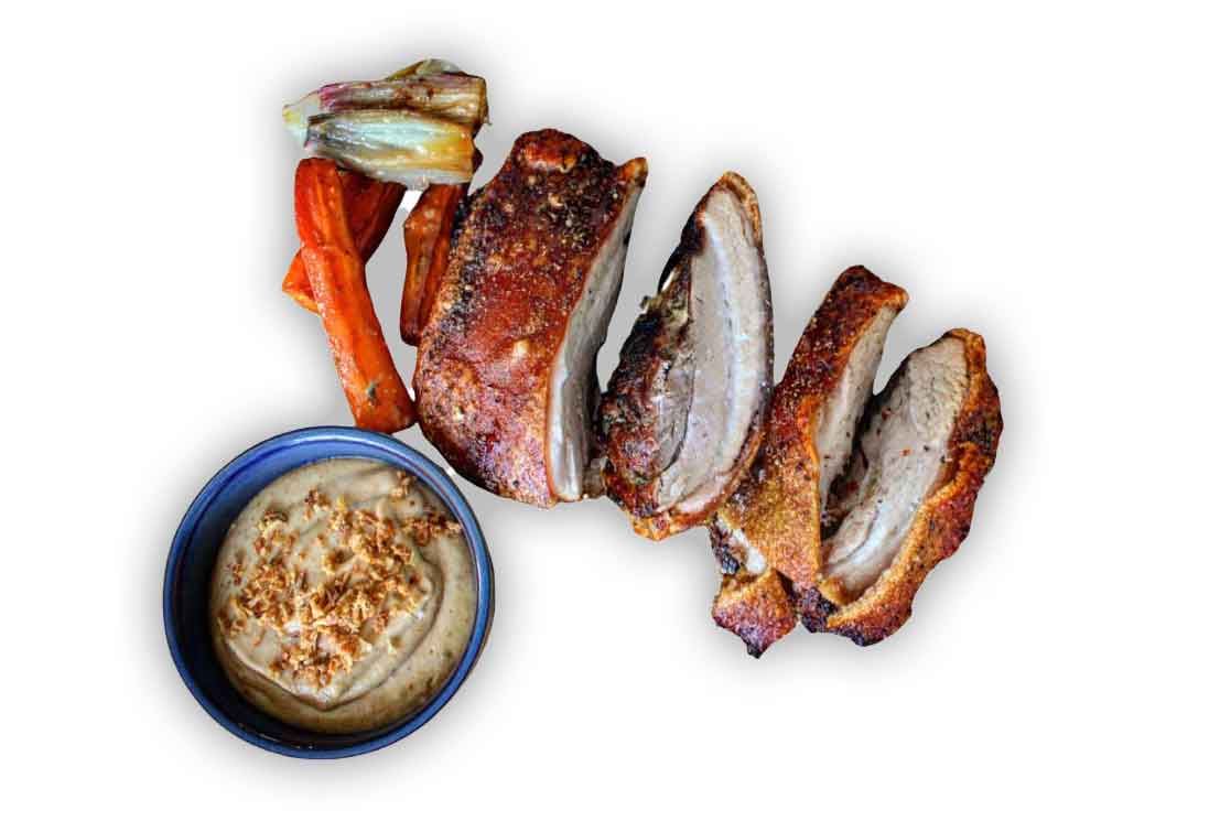 Pork belly cuts with crispy crackling and sauce