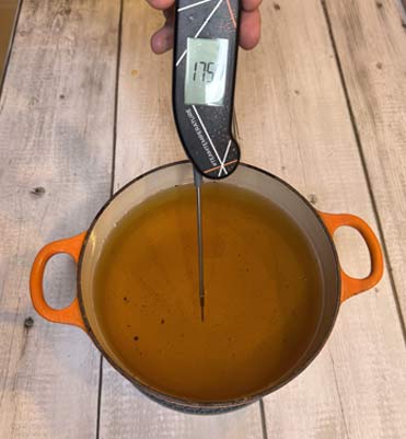 Thermapen taking the temperature of oil