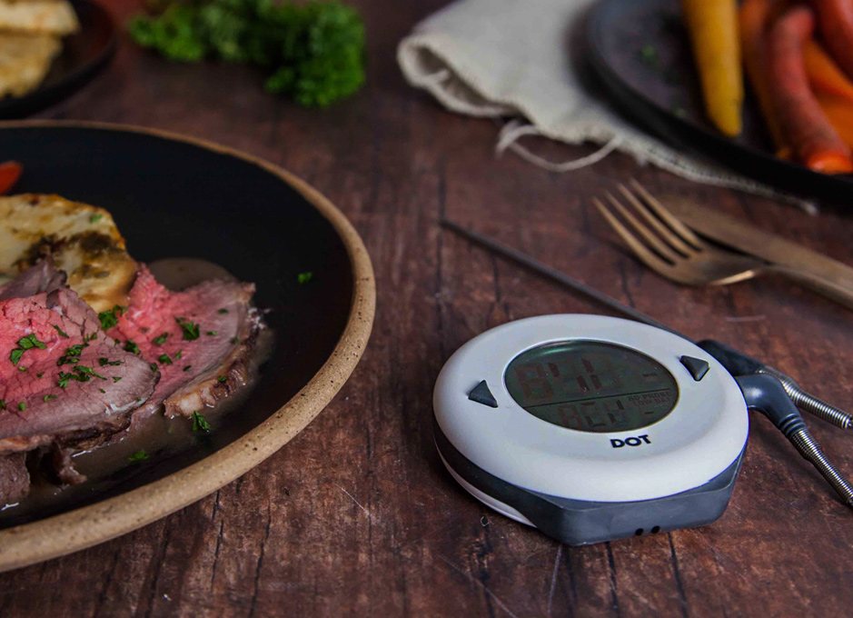 This image features several Thermapen brand cooking thermometers and accessories arranged on a dark, festive background with silver tinsel.