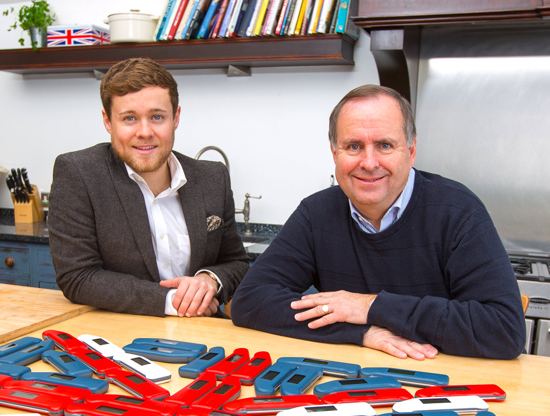 Founder and Managing Director, Father & Son, sat at a kitchen table full of Thermapen, food thermometers