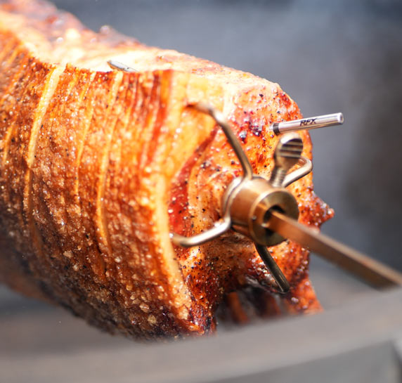 RFX Meat probe inserted in a pork with crackling that is turning in a rotisserie