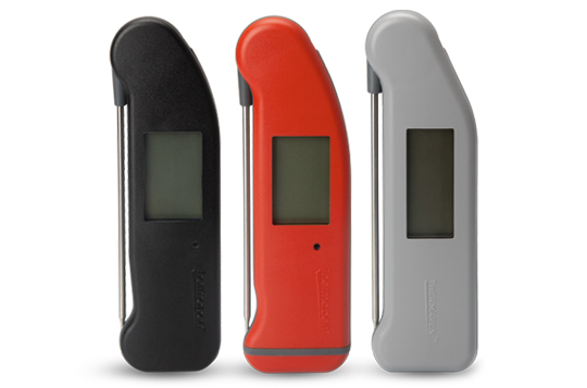 Three modern Thermapen food thermometers, one black, one red and one grey