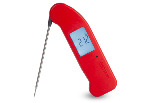Red, handheld, Thermapen food thermometer displaying its auto back lite display