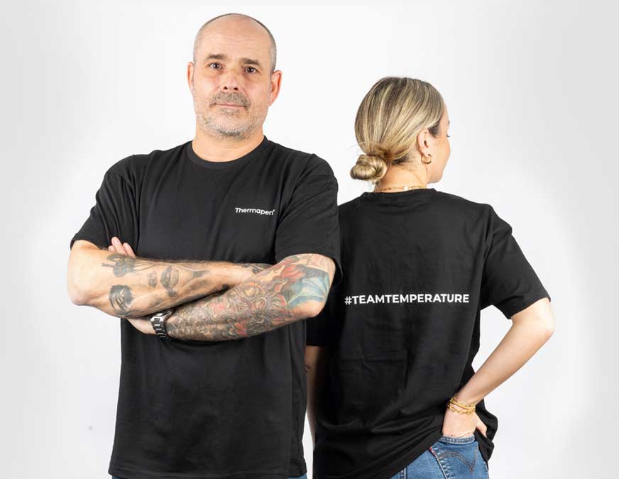 A man and a woman wearing Thermapen branded TeamTemperature T-Shirts